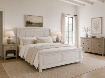 White sleigh bed with a storage footboard in a bright farmhouse-style bedroom.