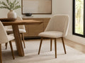 Ronald Cream Dining Chair in a dining room setting. 