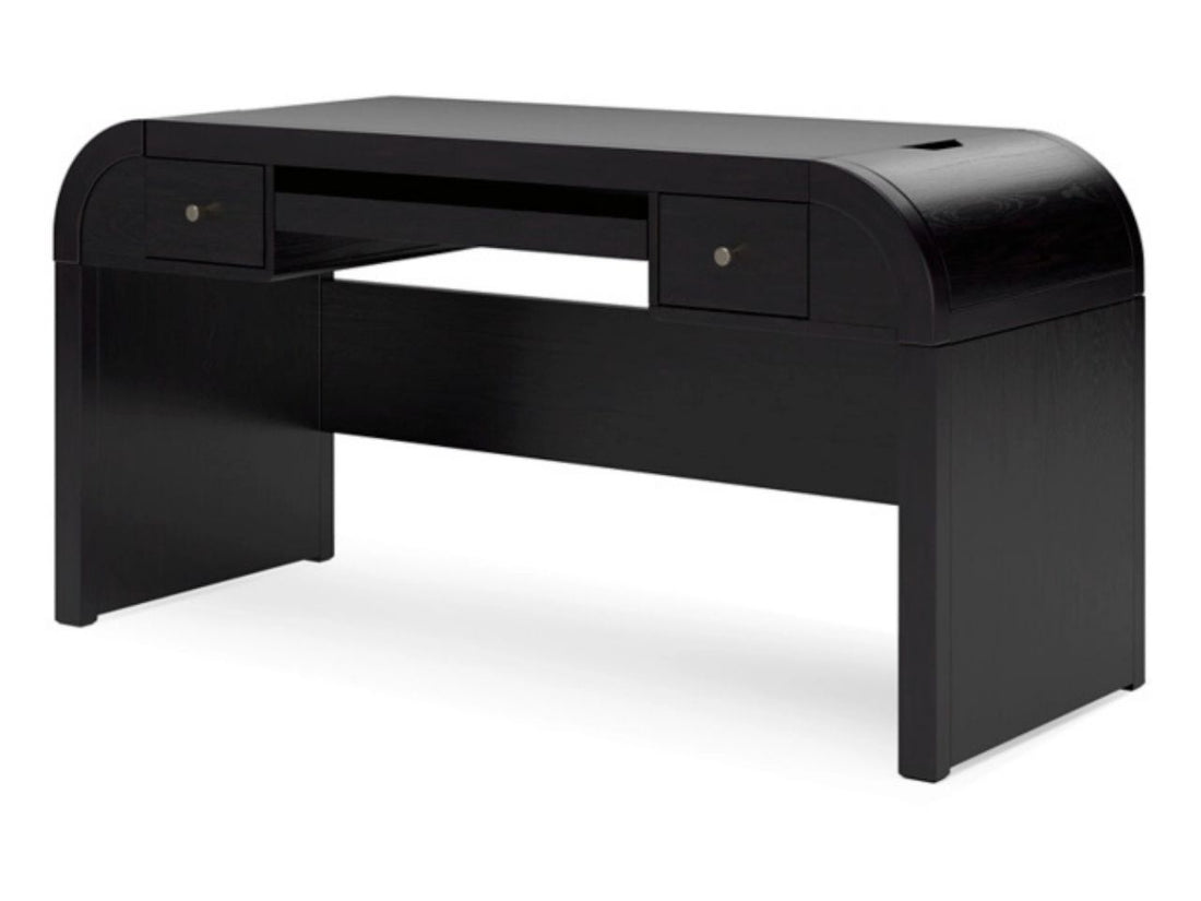 The Rowanbeck is a sleek, minimalist desk crafted from wood with a dark charcoal or black finish.
