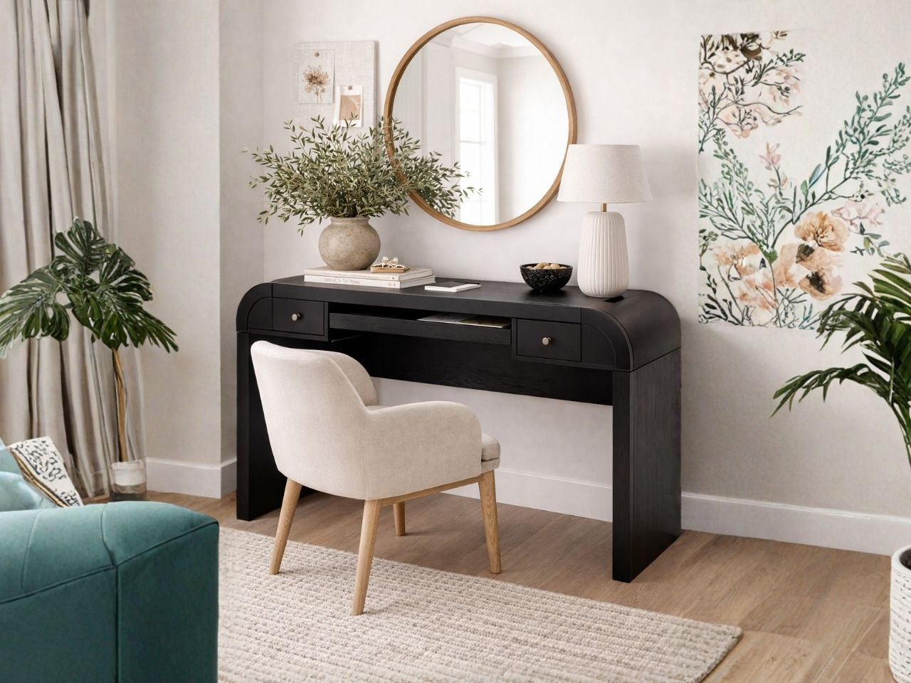 The Rowanbeck is a sleek, minimalist desk crafted from wood with a dark charcoal or black finish.