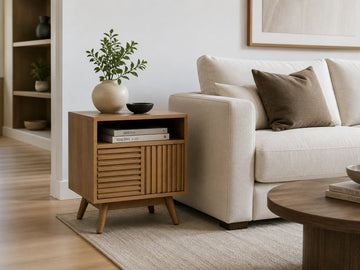 Wood side table with storage beside a cream sofa in a bright living room.