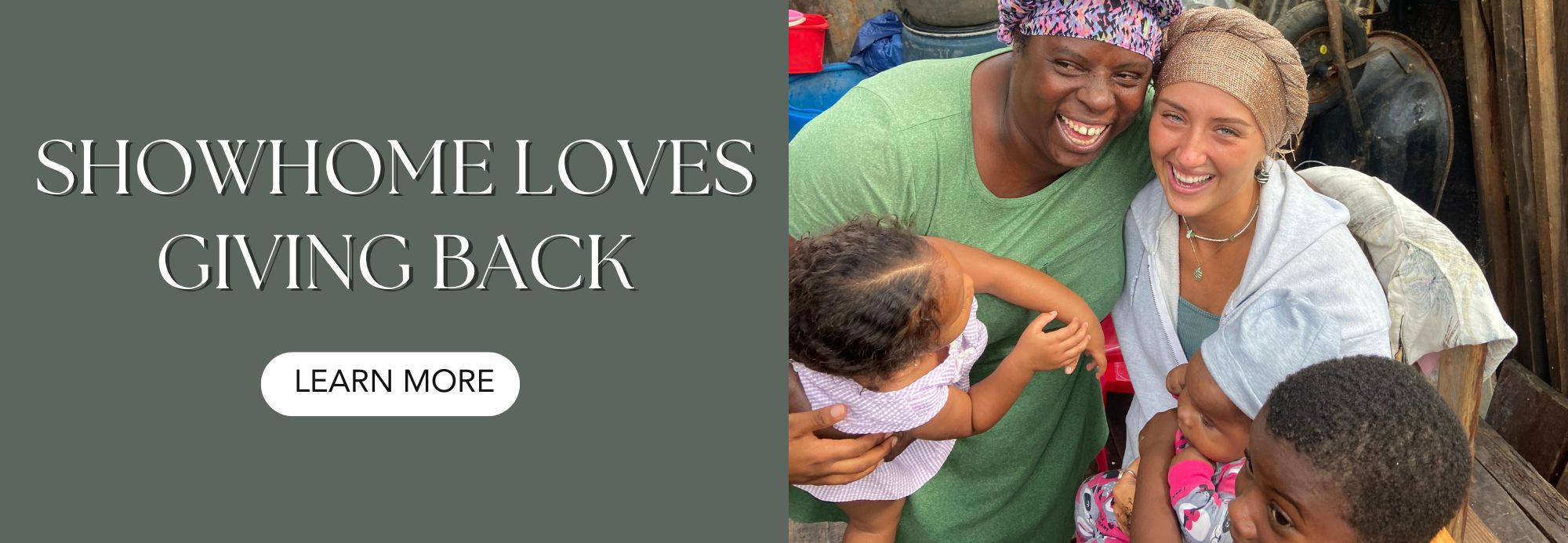 Two women and a child hugging, with text 'Showhome Loves Giving Back'