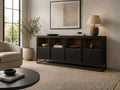 Contemporary dark wood sideboard with display shelving and a sleek metal base, styled in a modern living room with warm neutral décor and accent lighting.