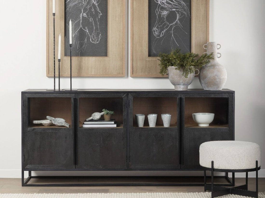 The Sloan Sideboard is a wide, rectangular storage piece featuring four cabinet doors in a dark, textured charcoal or near-black finish.