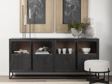 The Sloan Sideboard is a wide, rectangular storage piece featuring four cabinet doors in a dark, textured charcoal or near-black finish.
