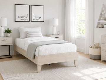Light wood twin platform bed with a simple modern design.