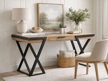 This desk features a mixed-material design, combining a thick, light-toned wood tabletop with industrial black metal accents.