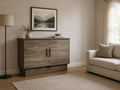 Rustic grey Murphy bed cabinet with weathered wood finish, modern black handles, and cozy neutral living room styling.