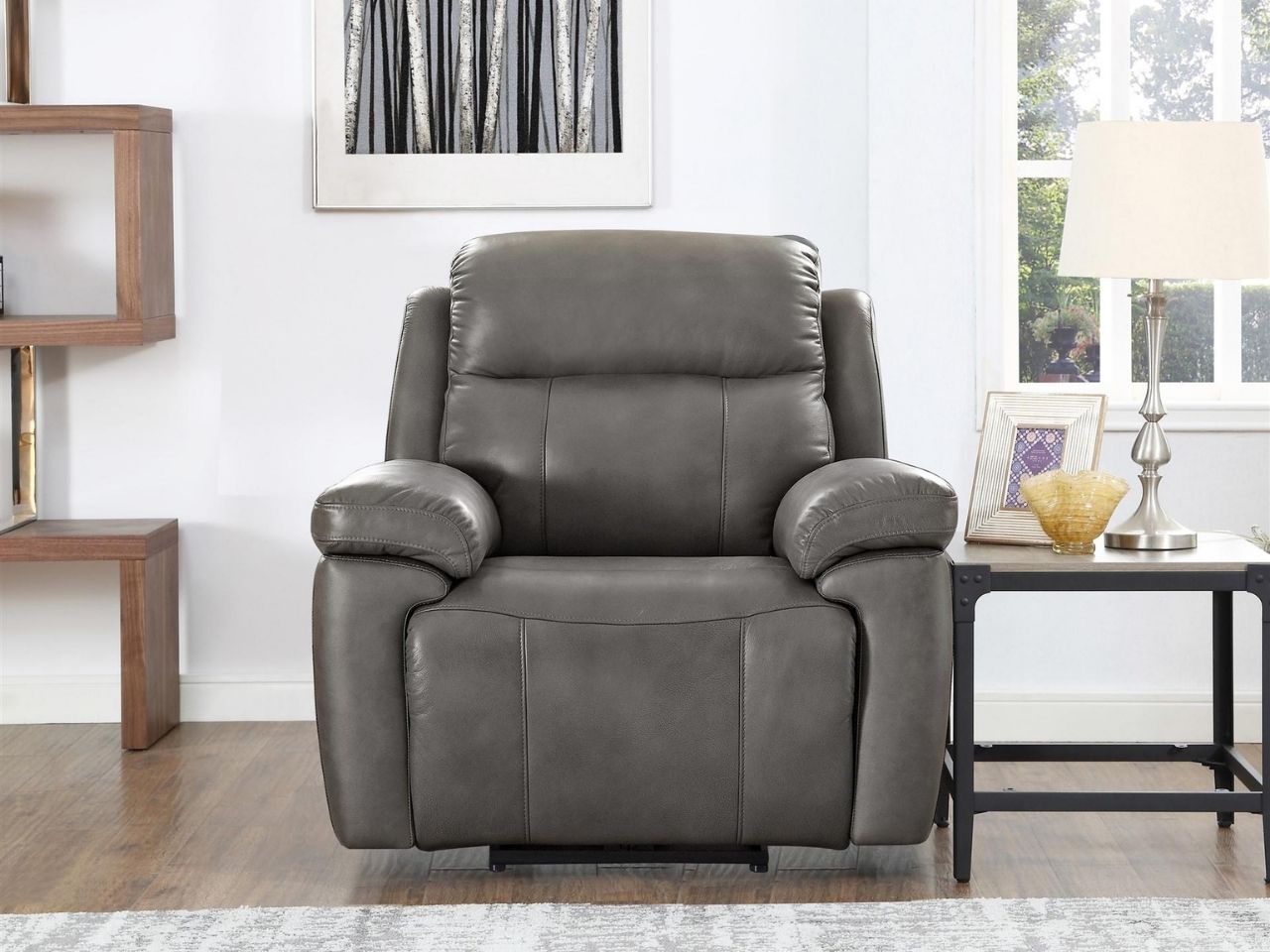 Gray leather power recliner chair styled in a bright living room.