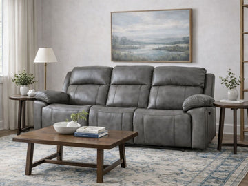 Gray leather reclining sofa styled in a modern living room.