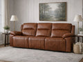 Brown leather reclining sofa with plush cushions in a cozy living room.
