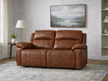 Brown leather reclining loveseat with plush cushions in a living room.