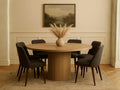 Terra Light Brown Wood Round Dining Table with dark chairs in Calgary