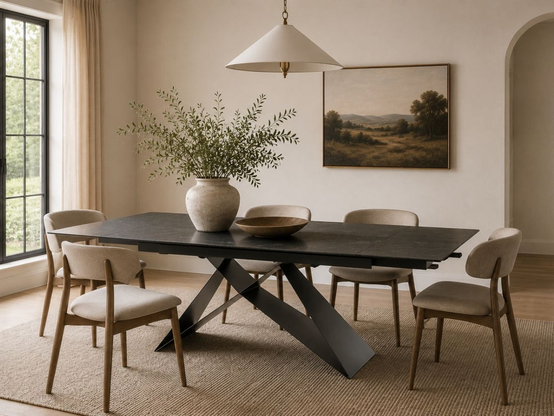 Slate grey dining table with six upholstered chairs.