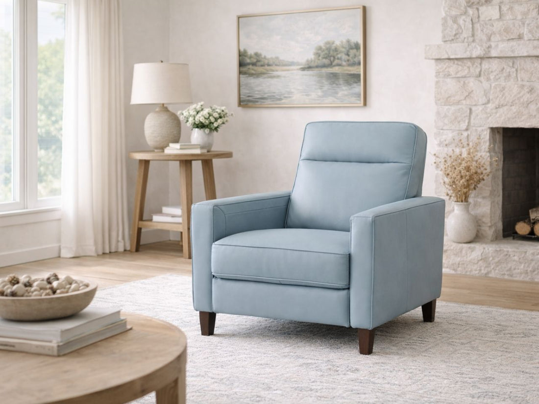 Brown leather recliner chair placed in a warm, modern living room.
