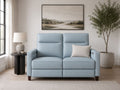Light blue leather loveseat with power reclining seats in a clean, contemporary living room.