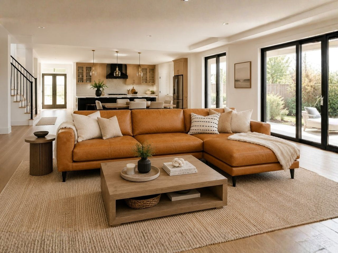 leather sectional sofa styled in a bright, modern open-concept living room with neutral décor.