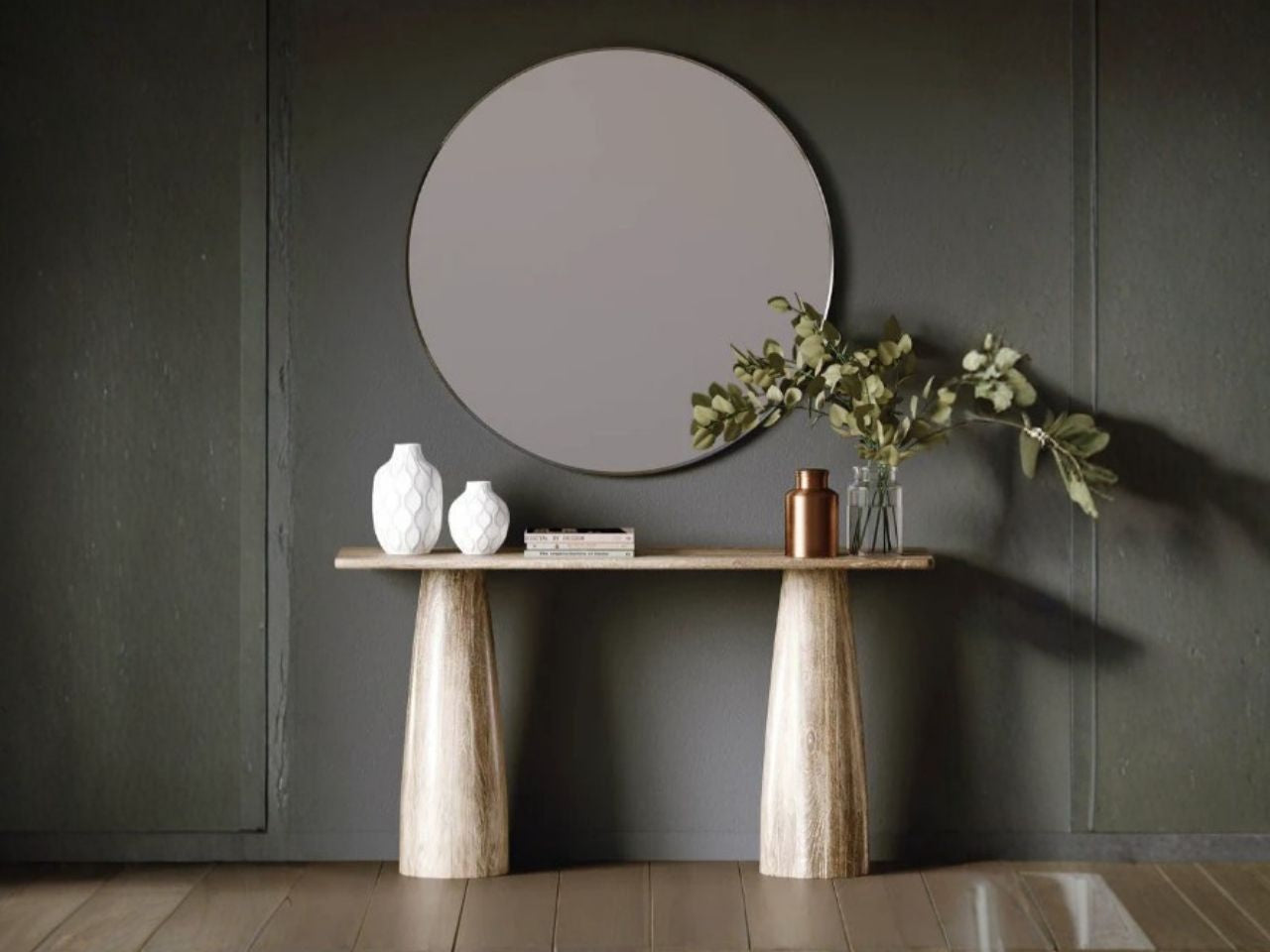 A minimalist, light wood console table featuring two thick, tapered sculptural pedestal legs and a slim rectangular top.