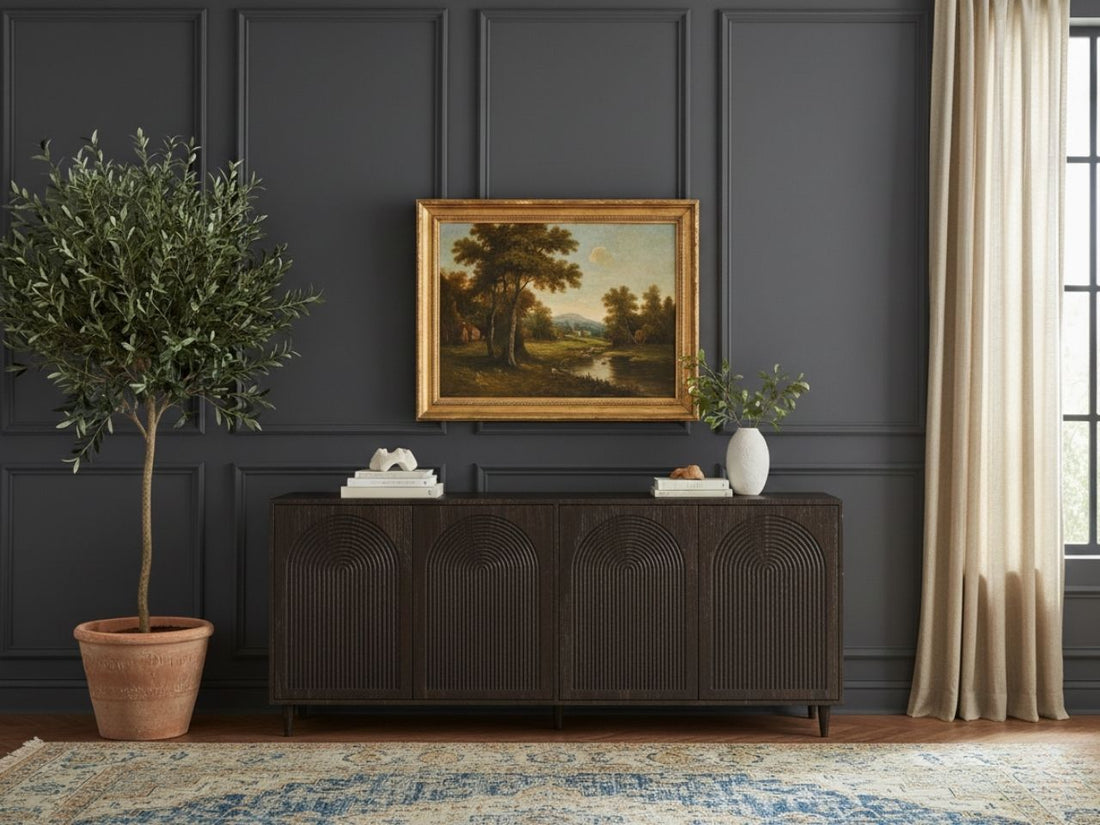 A dark brown, four-door wooden sideboard featuring deep, repetitive arched relief carvings on the front panels, set against a dark gray paneled wall.
