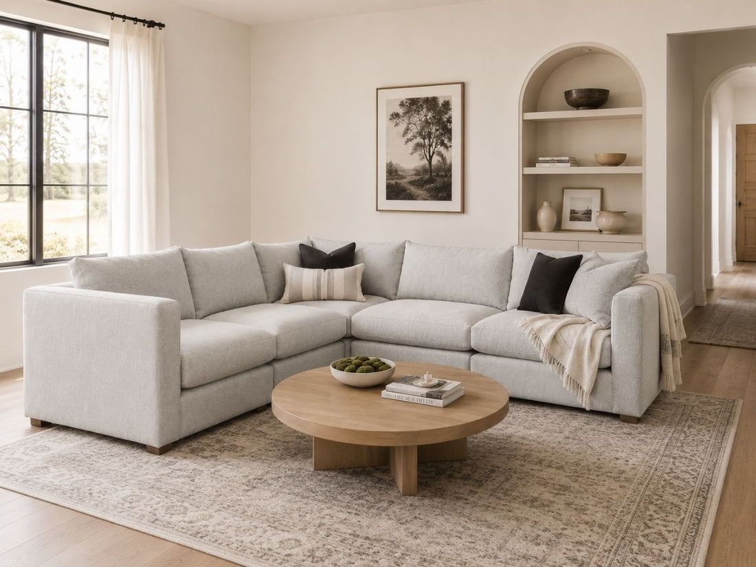 Light gray modular sectional in a bright modern living room.