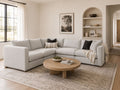 Light gray modular sectional in a bright modern living room.