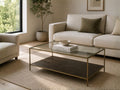 Glass coffee table with a metal frame and lower shelf in a modern living room.
