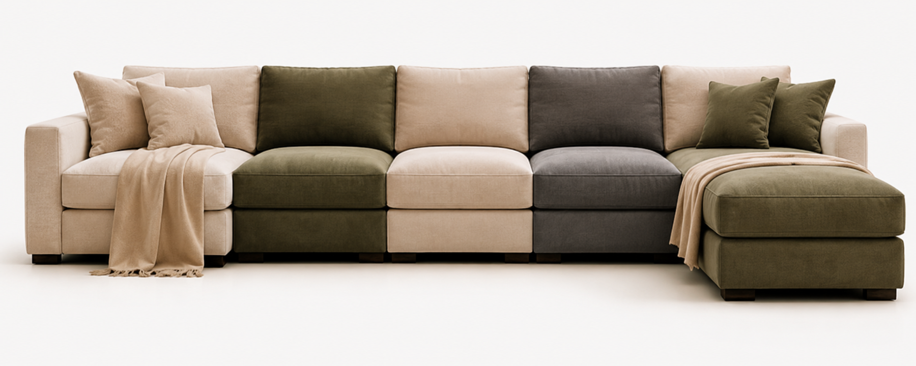 A modern sectional sofa in Calgary with a chaise lounge, upholstered in blocky panels of beige, olive green, and charcoal gray, styled with matching throw pillows and a draped beige throw blanket on a seamless white background.