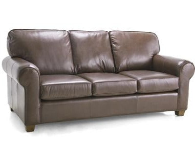 Custom Top Grain Sofa with orange and yellow cushions in a living room setting.